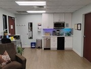 View of the Front Door, Kitchenette and Office Door from the Waiting Area
