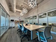 Boardroom on second floor with glass paneling throughout