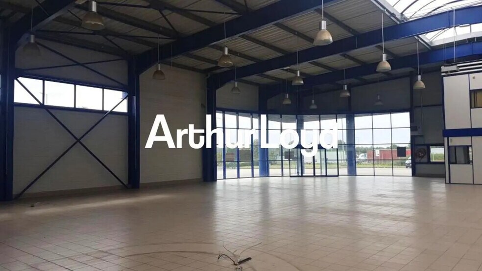 Local d’activités dans Bretteville-sur-Odon à louer - Photo de l’immeuble – Image 1 sur 3
