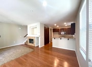 End Unit With More Windows. Living Room Has a Fireplace